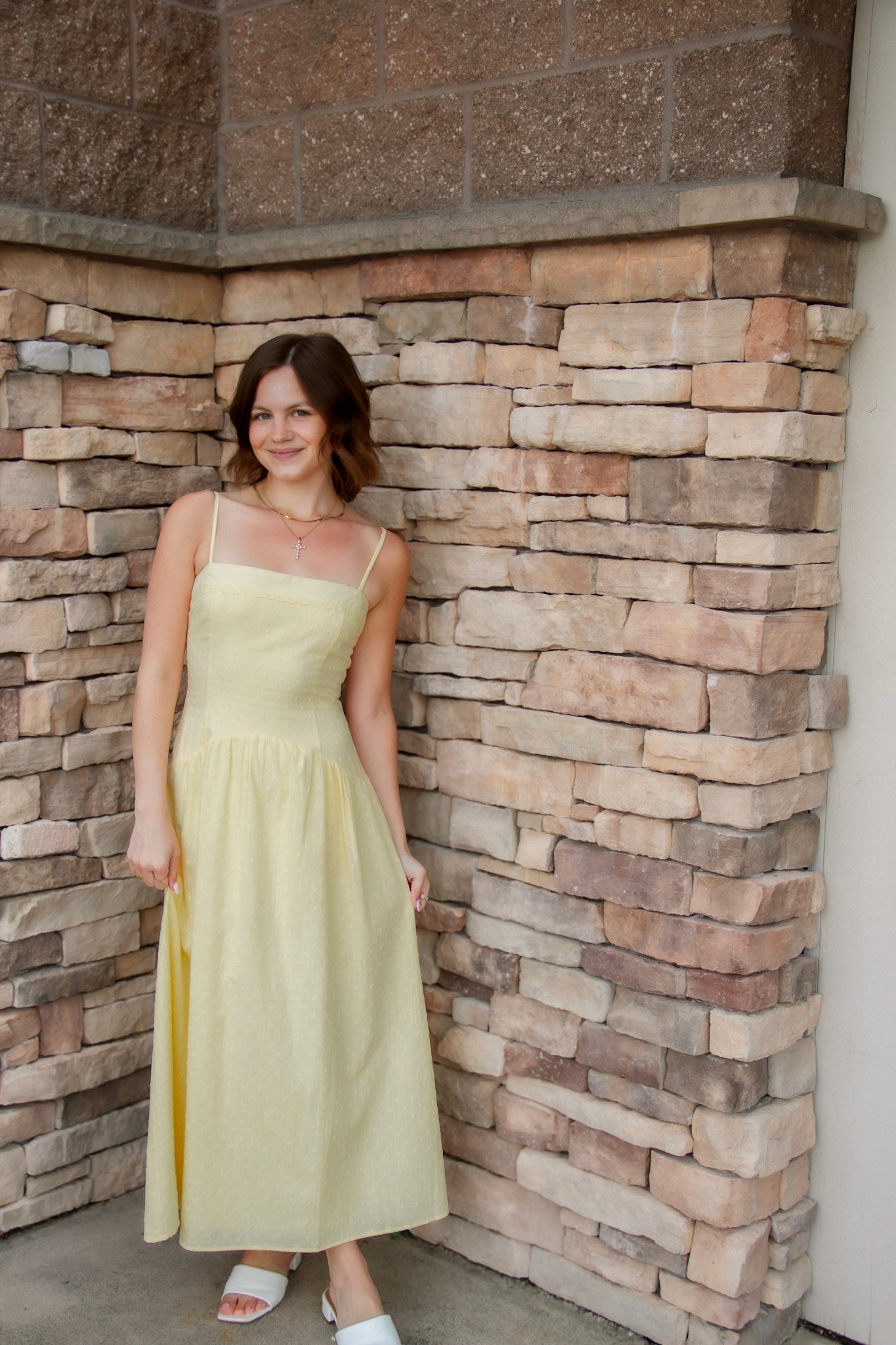 yellow midi dress with drop waist, textured detail, adjustable spaghetti straps and yellow sandals