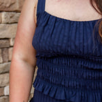 navy smocked top with stretch and a matching navy midi skirt 