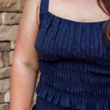 navy smocked top with stretch and a matching navy midi skirt 