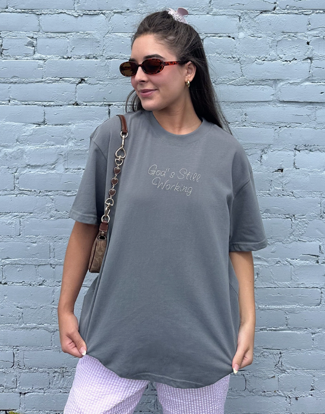 God's Still Working Unisex Tee