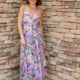 Floral midi dress with purple, green, coral and white colors. Pleated skirt and adjustable straps
