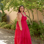 red and pink tank top style dress with tiered skirt and stretchy top and white sandals