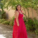 red and pink tank top style dress with tiered skirt and stretchy top and white sandals