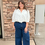 white button front top with long short sleeves 3/4 length. 