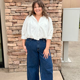 white button front top with long short sleeves 3/4 length. 