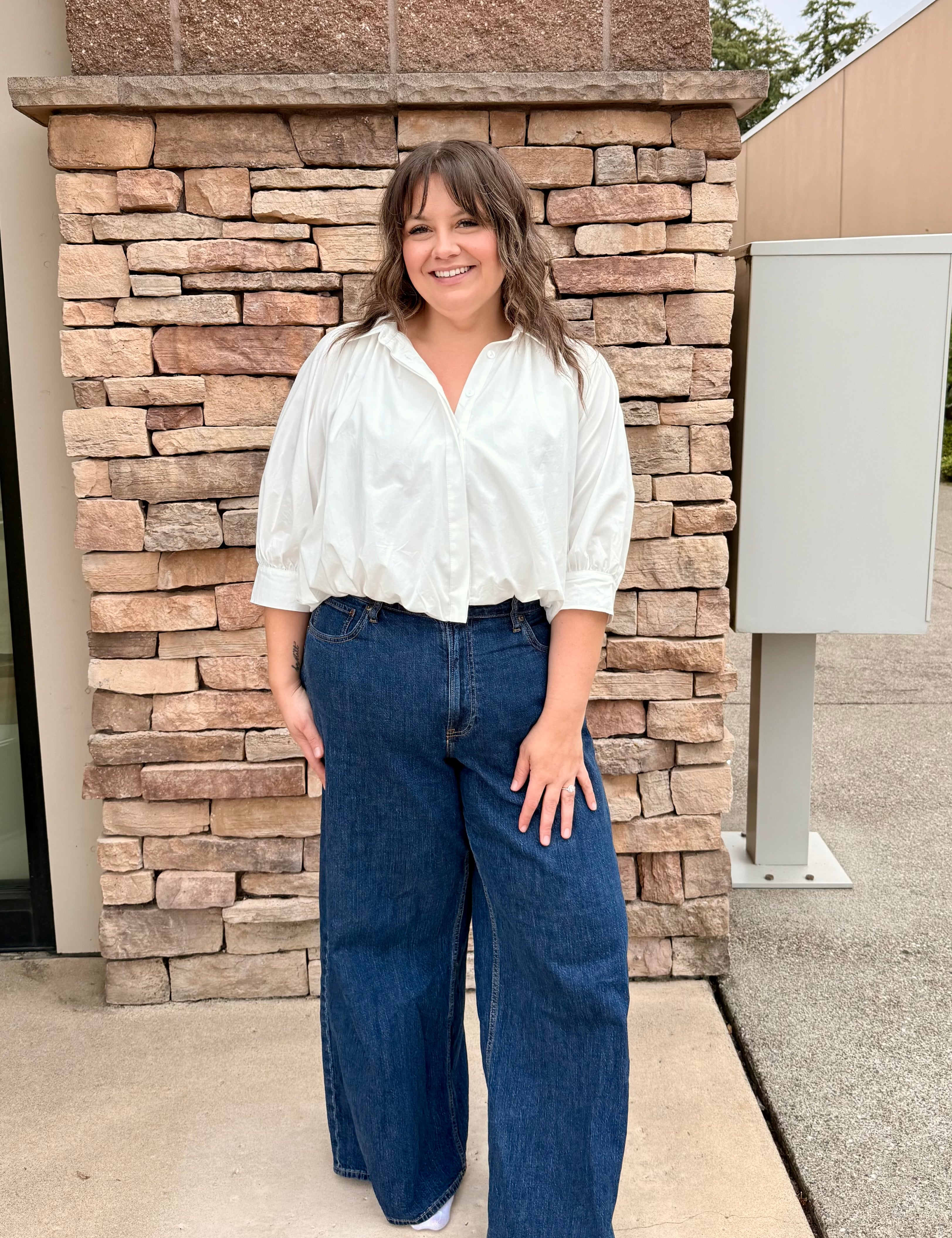 white button front top with long short sleeves 3/4 length. 