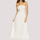 woman wearing a white spaghetti strap midi dress