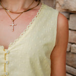 yellow mini dress with textured detail, v-neck and buttons down the front