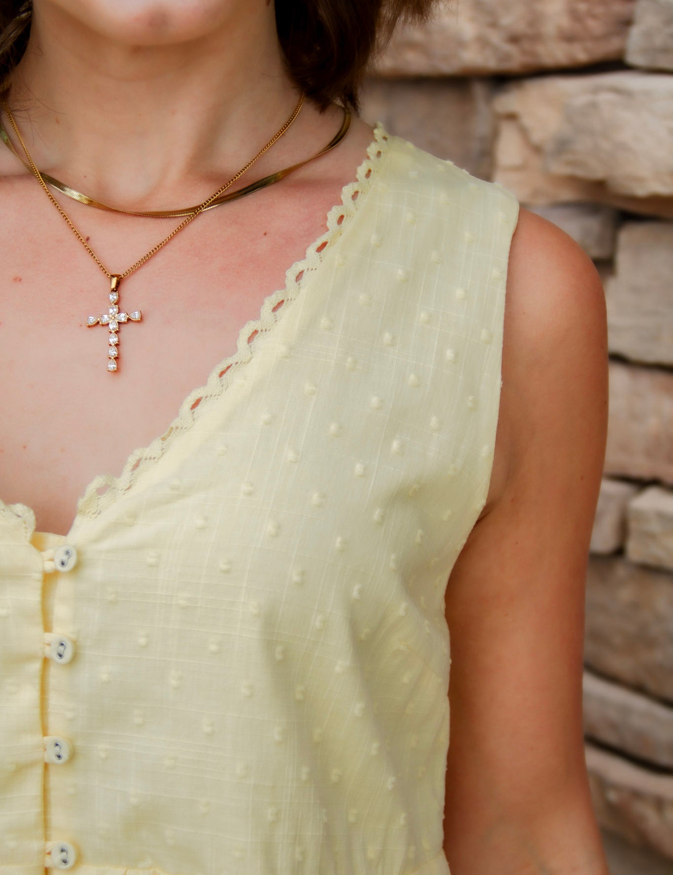 yellow mini dress with textured detail, v-neck and buttons down the front