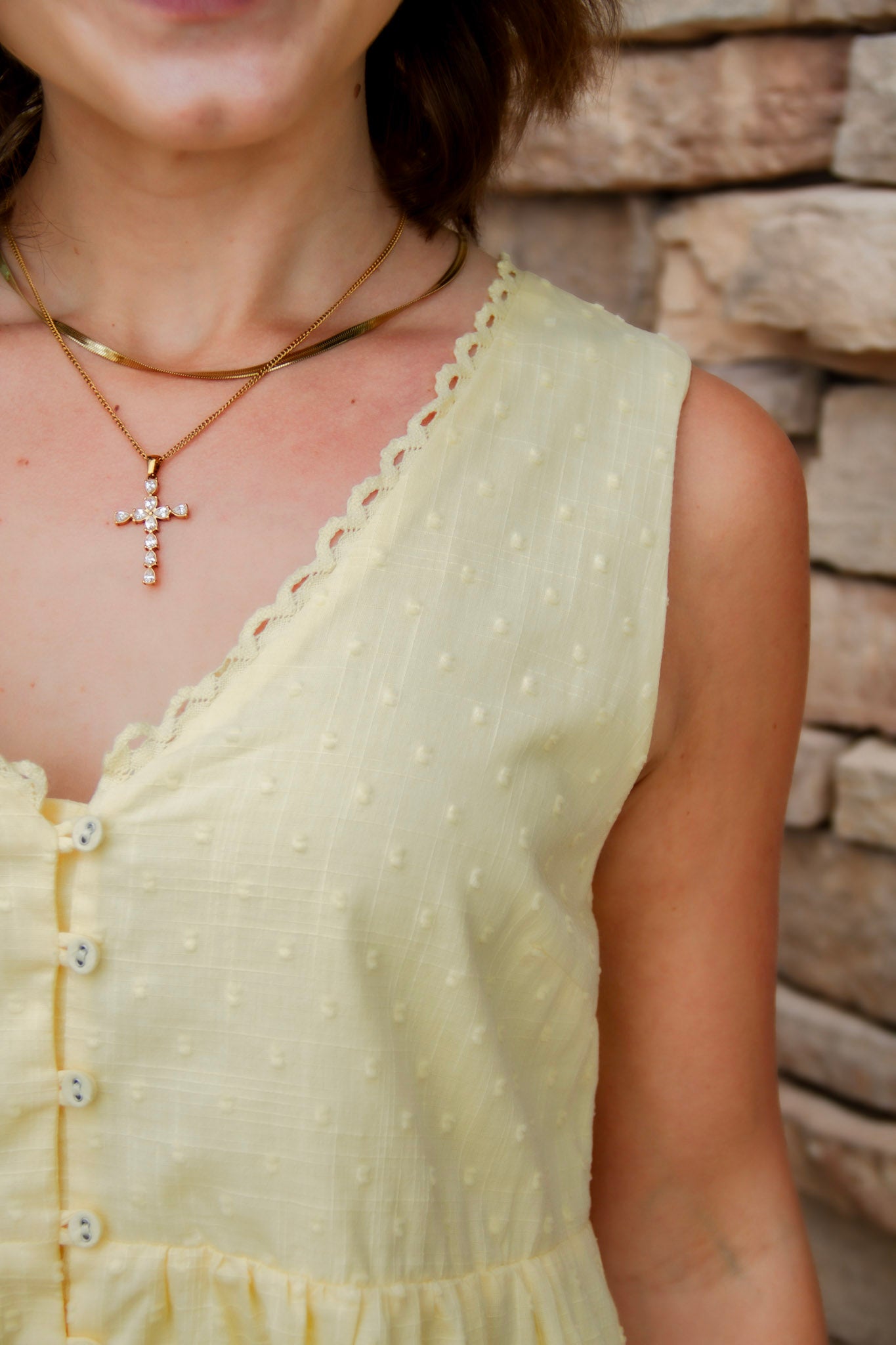 yellow mini dress with textured detail, v-neck and buttons down the front