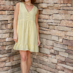 yellow mini dress with textured detail, v-neck and buttons down the front