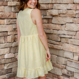 yellow mini dress with textured detail, v-neck and buttons down the front